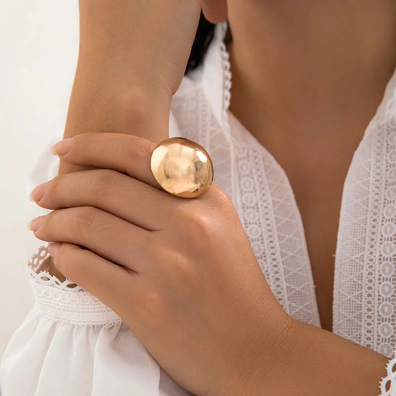 Gold-tone open adjustable ring with irregular oval cuff top