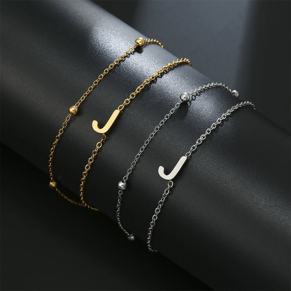 Initial letter bracelet set with J and J charms; gold and silver-tone chains