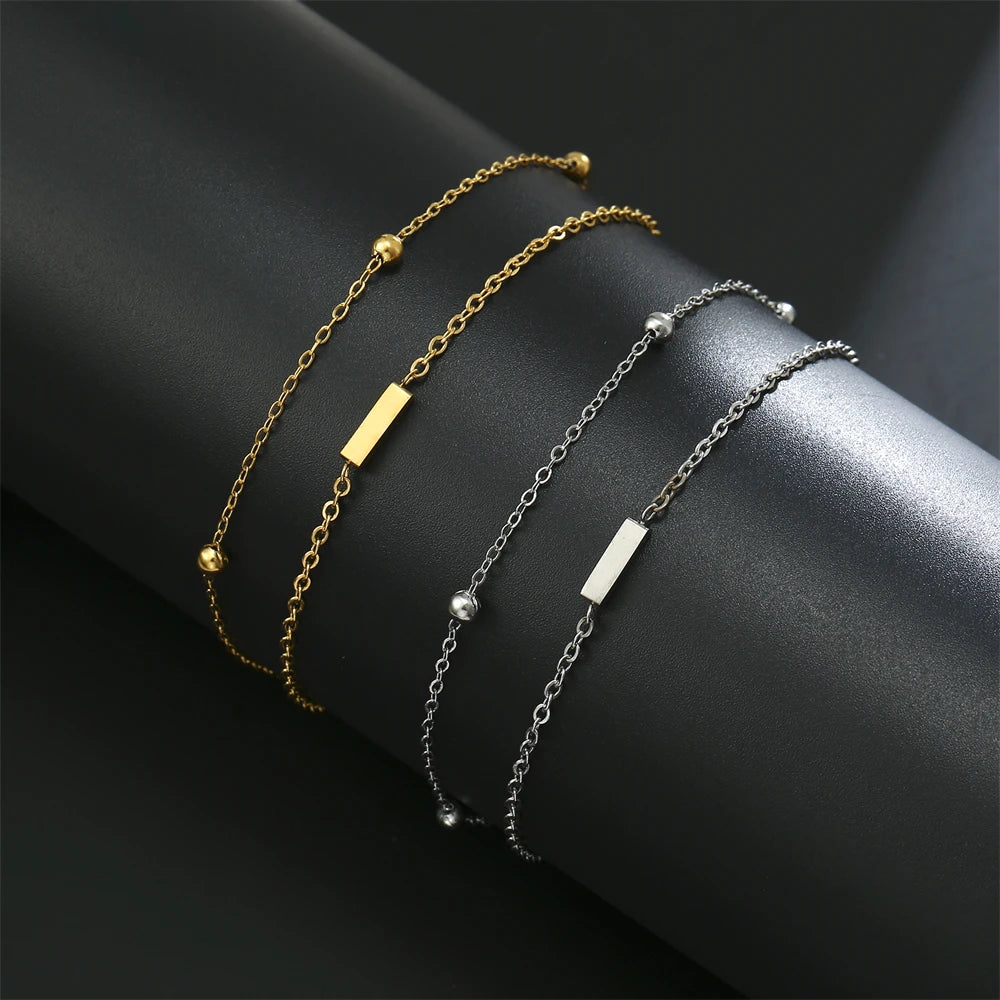 Initial letter bracelet set with I and I charms; gold and silver-tone chains