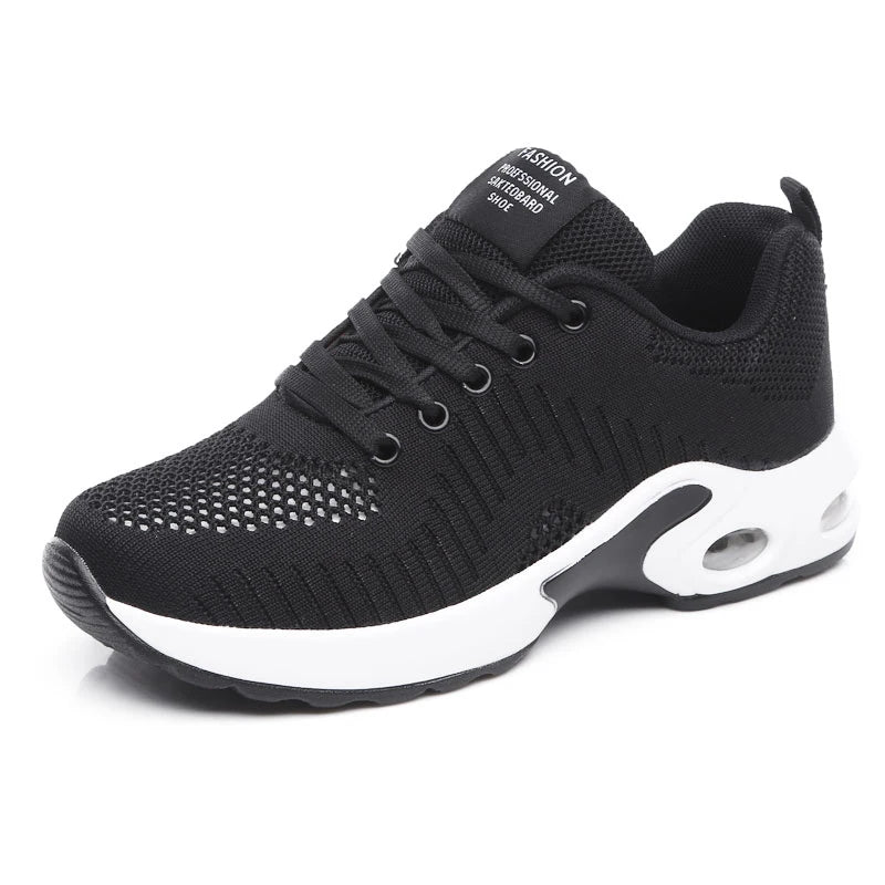 Black knit lace-up sneakers with white sole, cushioned tongue label, side oval logo