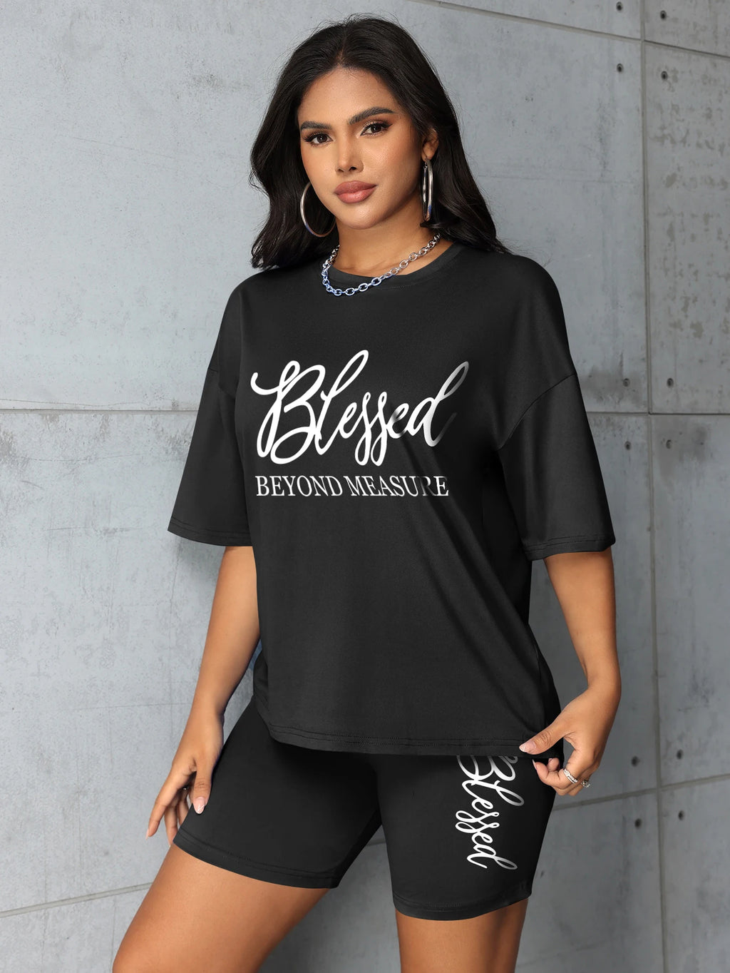 Women's plus size black graphic t-shirt & shorts set with 'Blessed' design