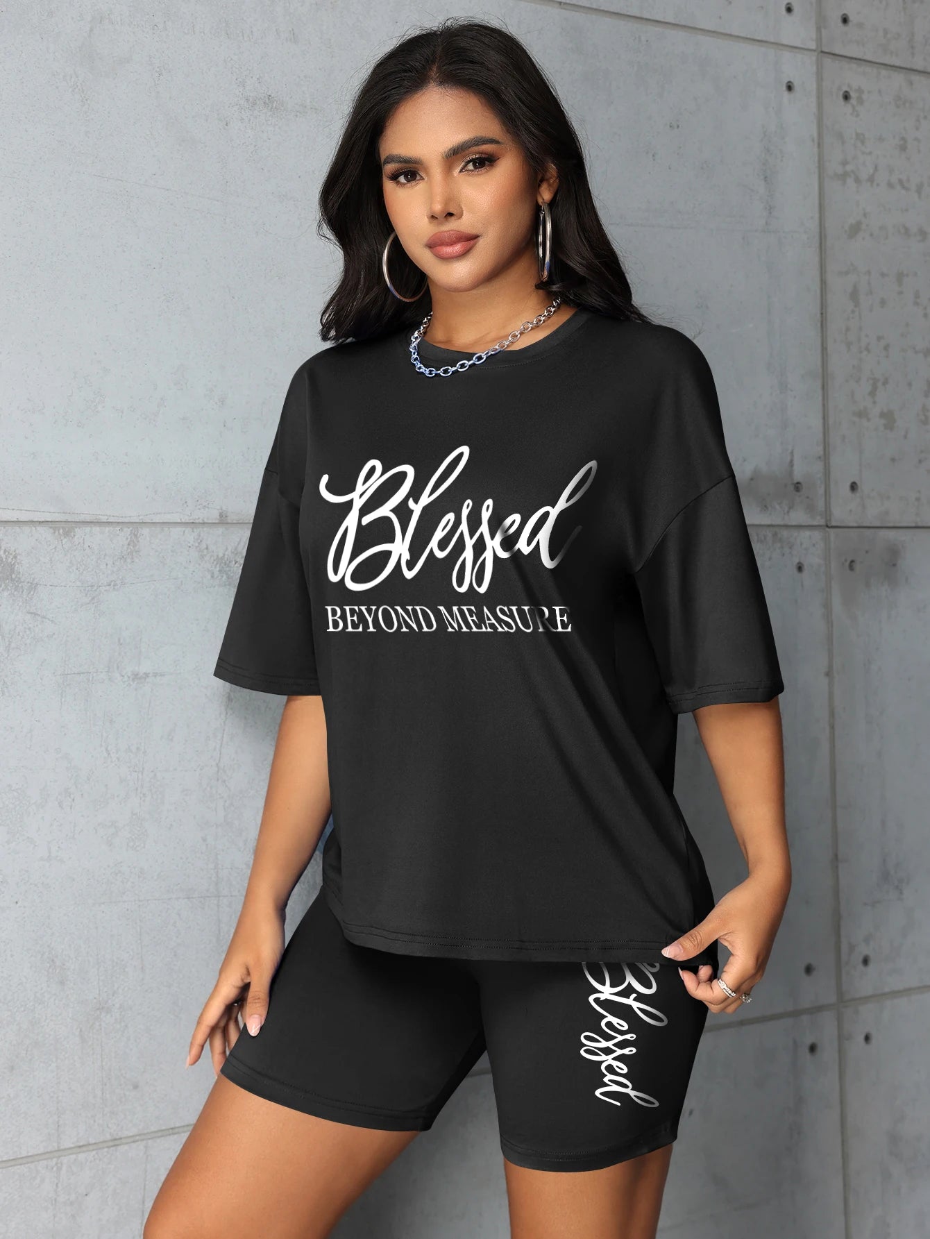 Women's plus size black graphic t-shirt & shorts set with 'Blessed' design