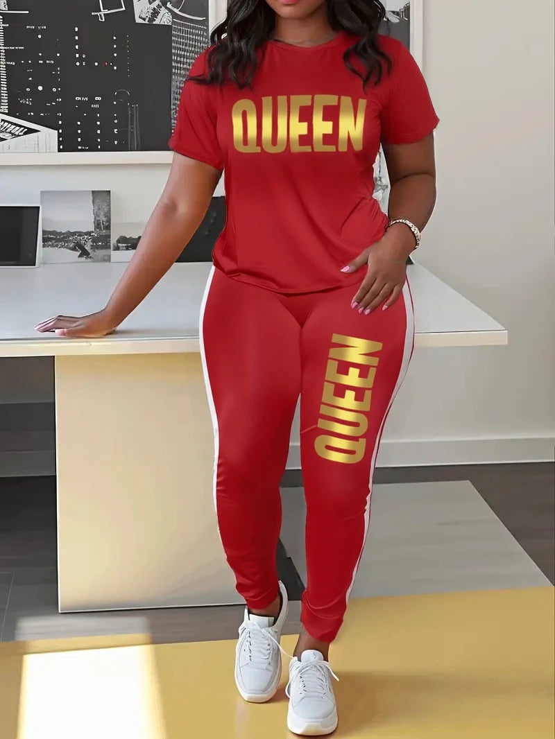 Red T-shirt and jogger set with yellow QUEEN print on chest and thigh.