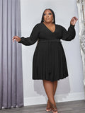 Black plus size V-neck long-sleeve dress with gathered pleated skirt