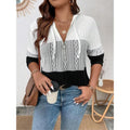Hooded zip-up top with patterned center and drawstring hood, long sleeves in white and black