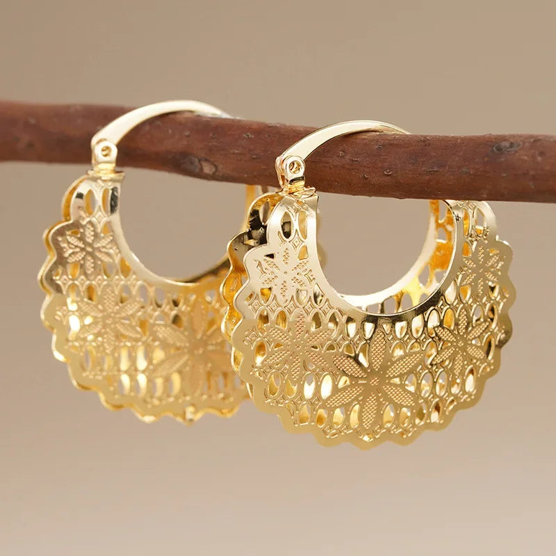 Gold filigree hoop earrings with heart-shaped hollow floral lace texture