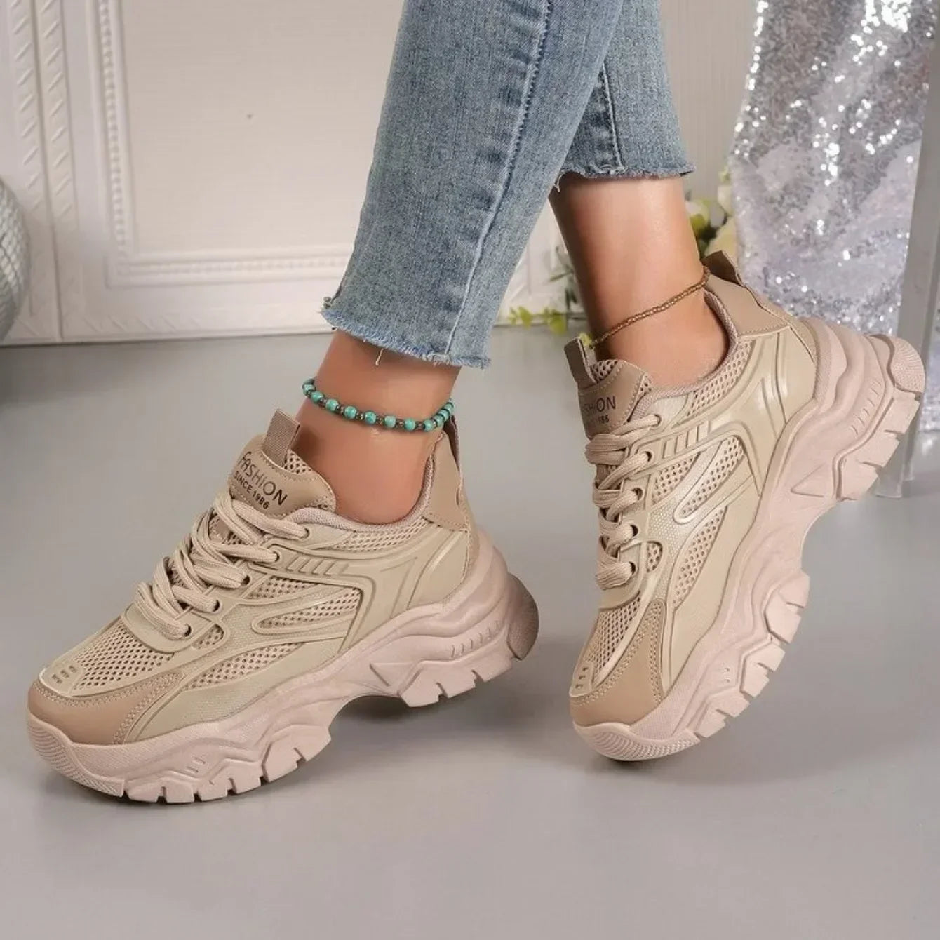 Beige chunky platform lace-up sneakers with lace-up front and cushioned chunky sole