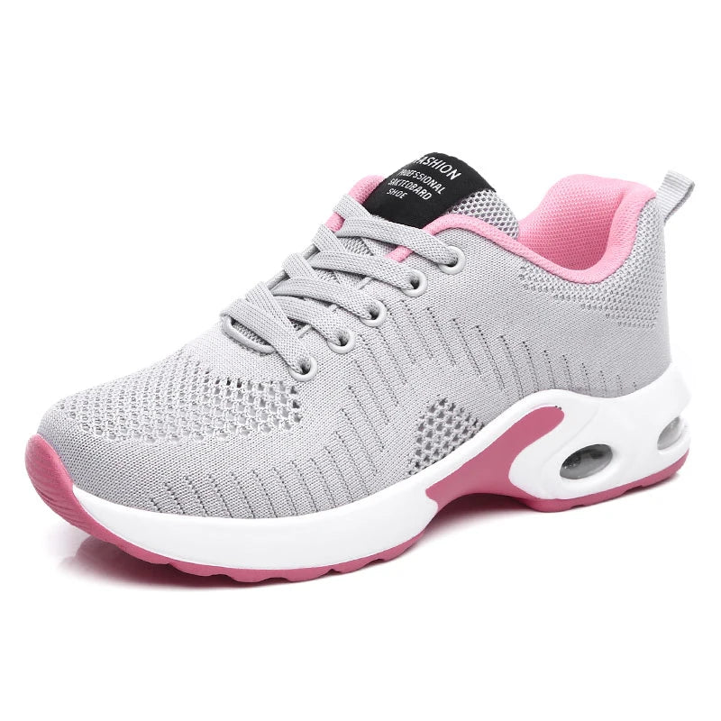 Light gray knit lace-up sneakers with pink collar and white sole, tongue patch