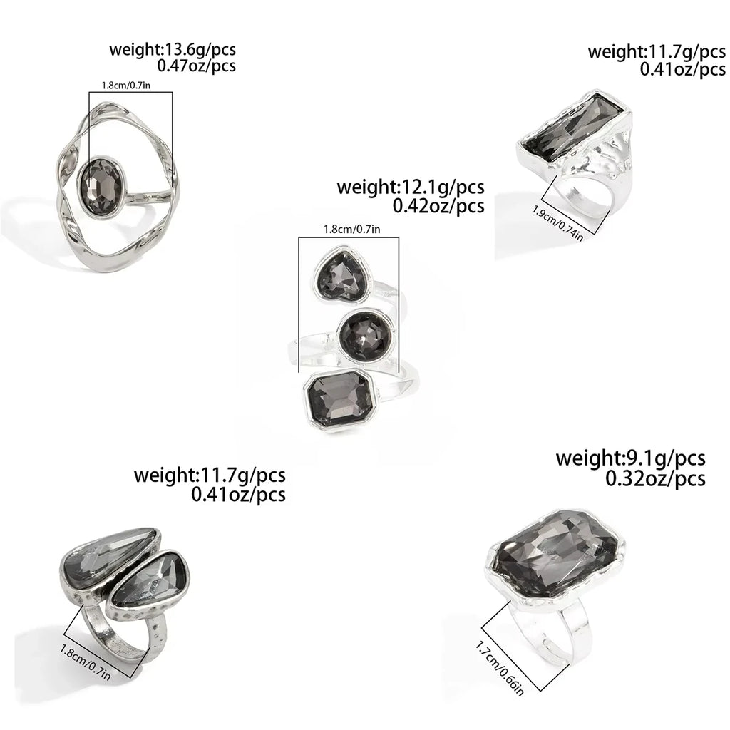 Set of silver open rings with dark rhinestones in geometric shapes