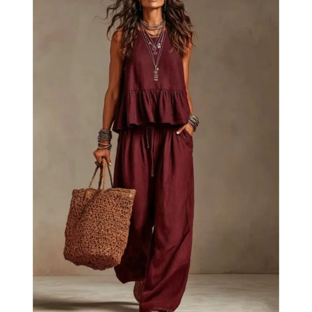 Burgundy sleeveless ruffled top and wide-leg trouser set with tiered peplum