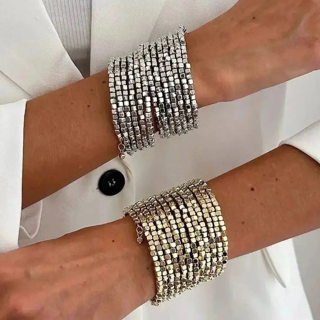 Wide beaded cuff bracelet with silver-tone square beads, layered stacked design.