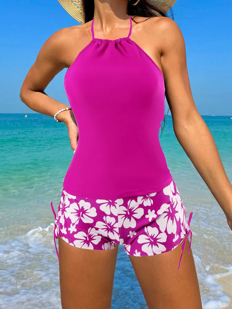 Women’s magenta halter tankini top with white-pink floral swim shorts
