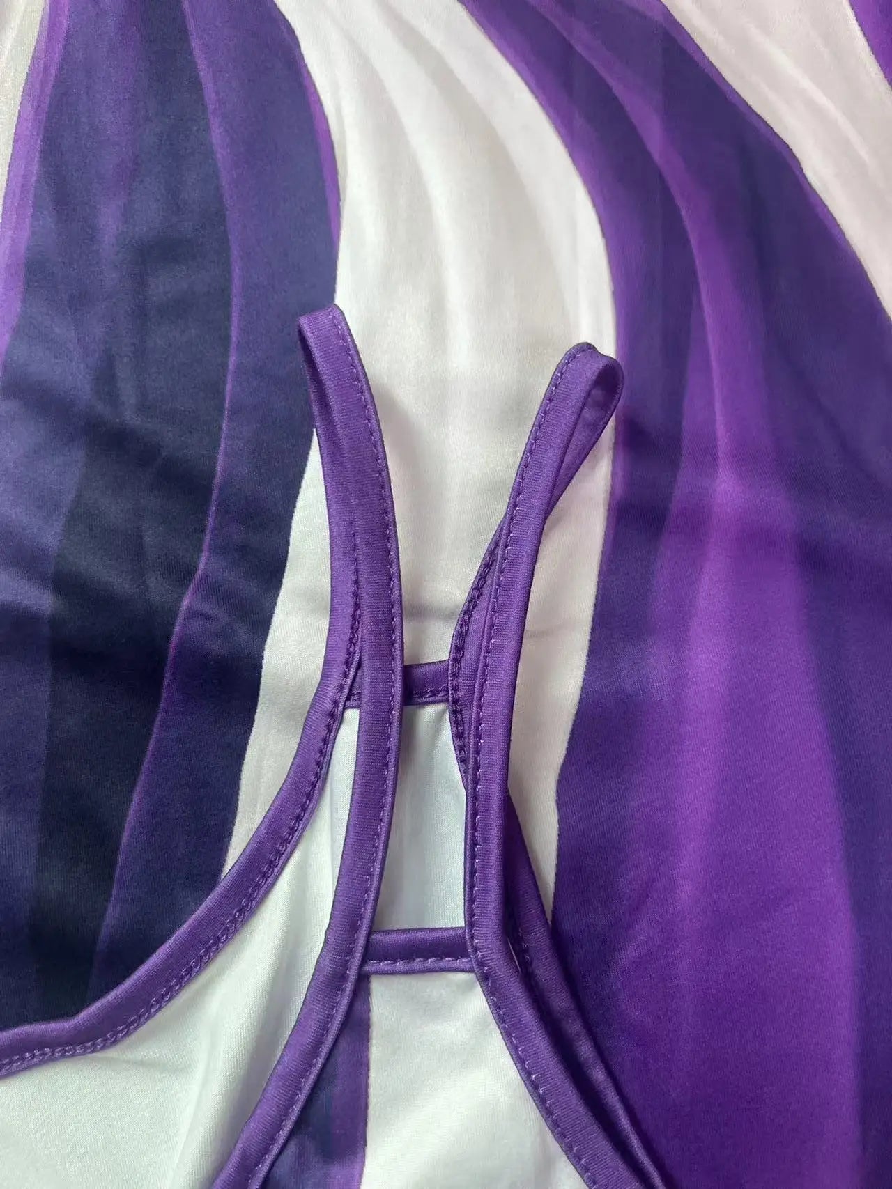 Purple and white asymmetrical geometric stripe dress close-up of double spaghetti straps