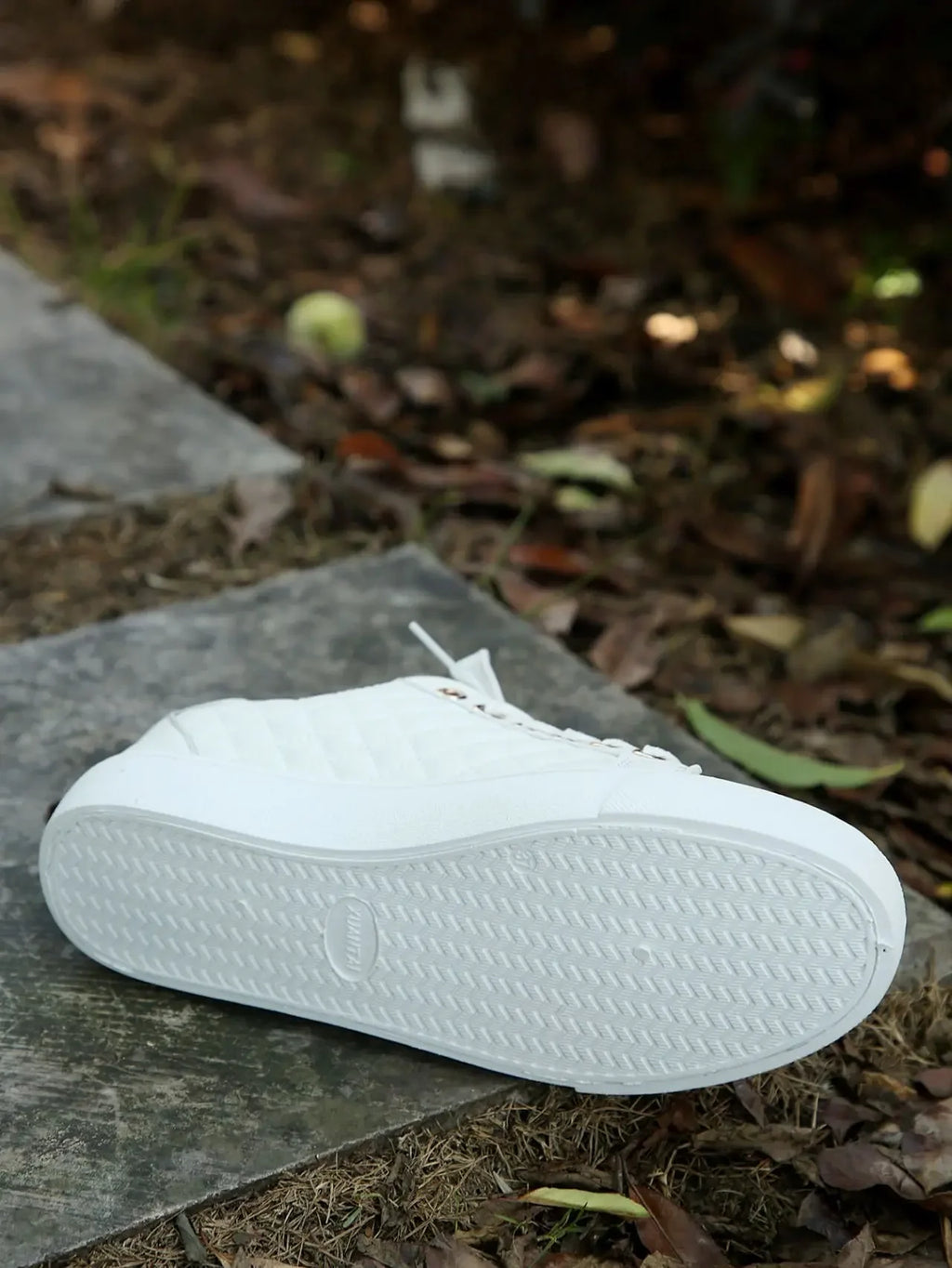 Women's white lace-up platform sneakers with textured rubber sole