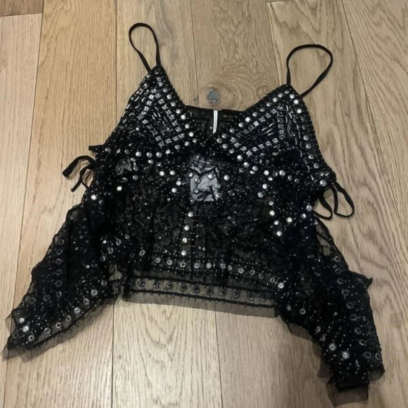 Black beaded sequin crop top laid flat with tie shoulder straps