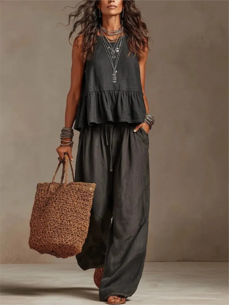 Charcoal sleeveless tiered ruffle top with matching wide-leg trousers