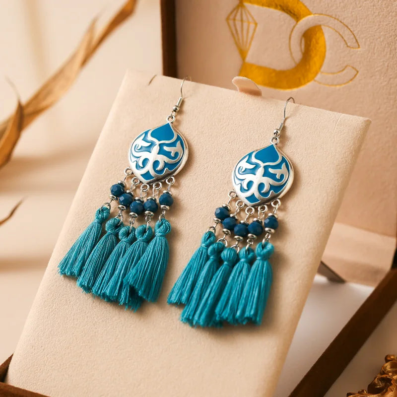 Boho tassel drop earrings with blue teardrop motif, turquoise tassels and beads
