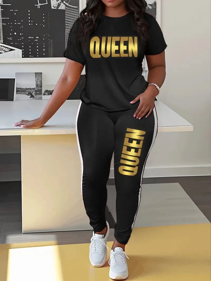 Black T-shirt and jogger set with yellow QUEEN print on chest and jogger leg.