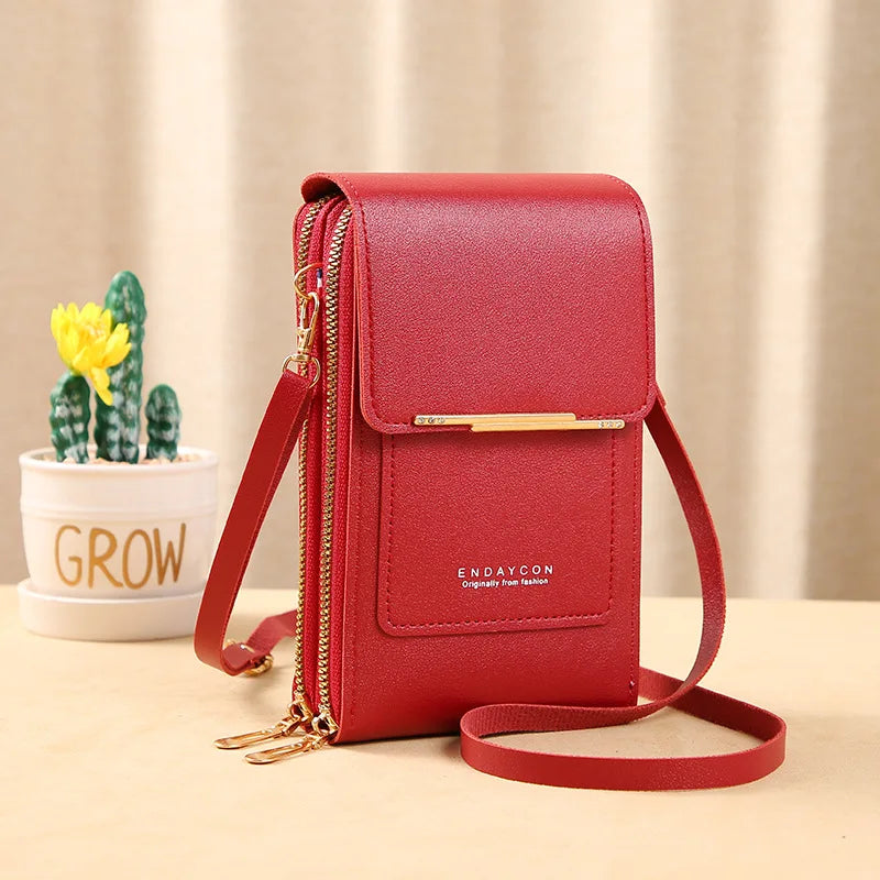 Red PU phone crossbody wallet with top flap, gold zipper, and crossbody strap.
