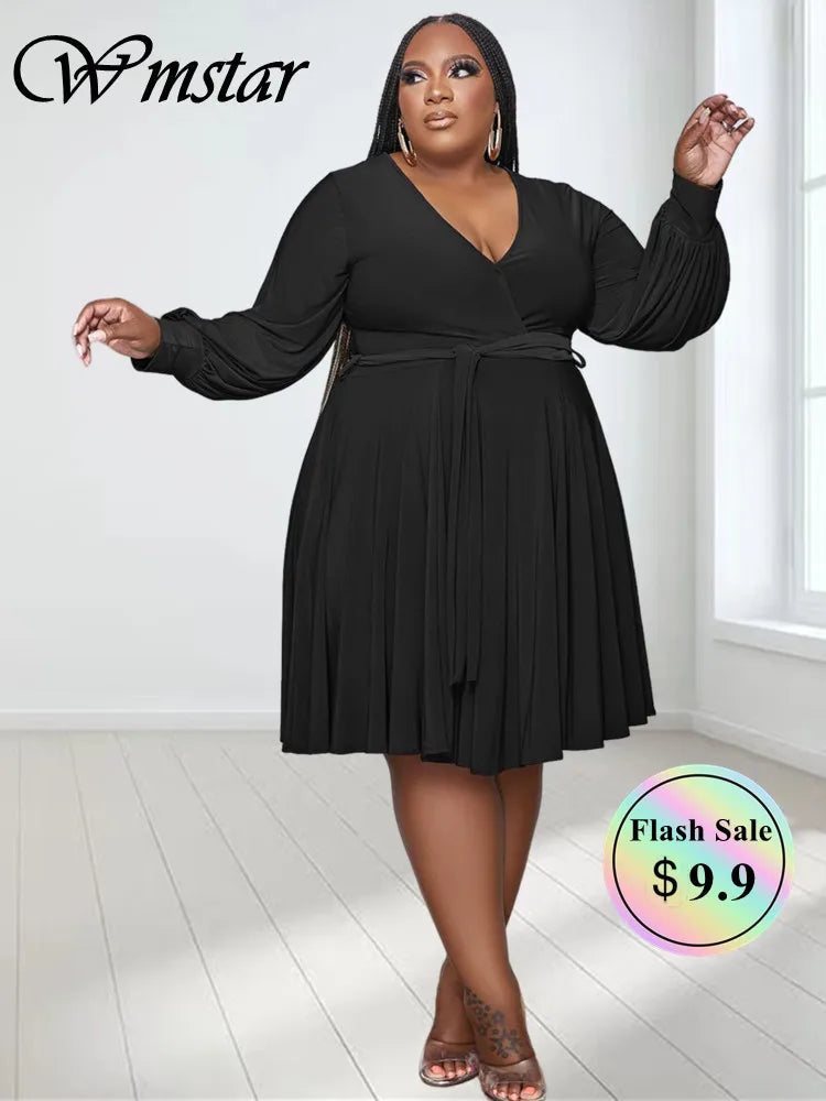 Black plus size V-neck long-sleeve dress with waist tie and pleated skirt
