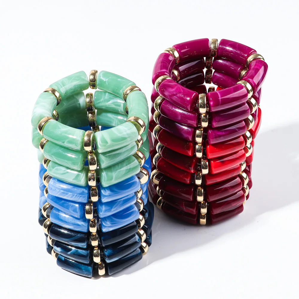 Bamboo tube bead bracelet set with green, blue, and deep purple tubes and gold accents