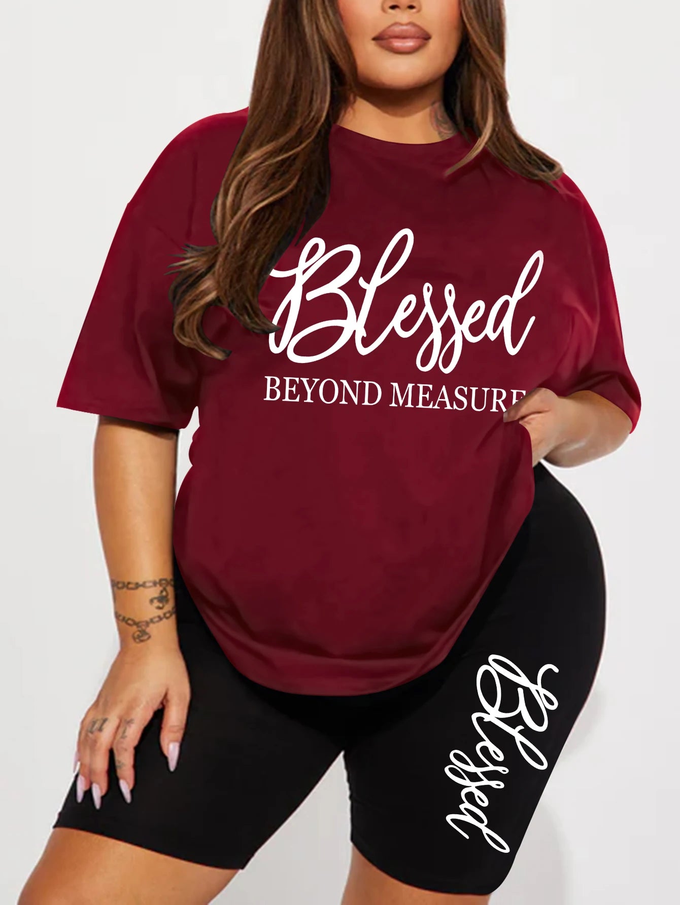 Plus size graphic short set: maroon T-shirt and black shorts with 'Blessed' print