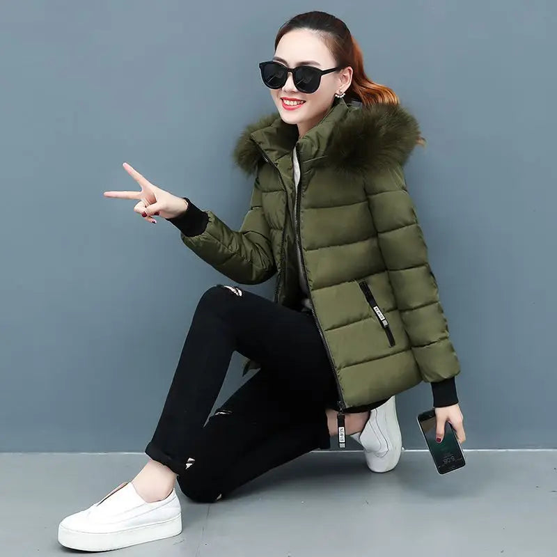 Olive green hooded puffer parka with faux fur hood trim and front zipper, quilted