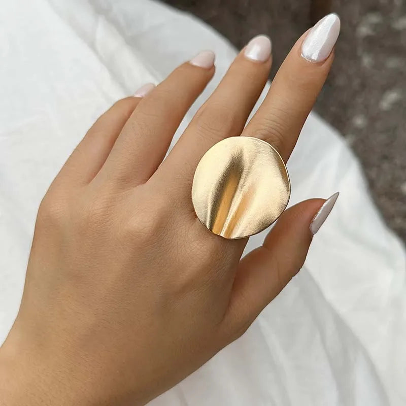 Gold-tone open adjustable oval cuff ring with brushed finish