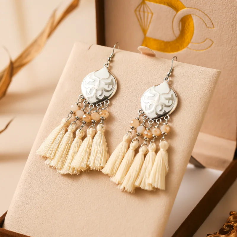 Boho tassel drop earrings with white enamel teardrop charm and ivory tassels