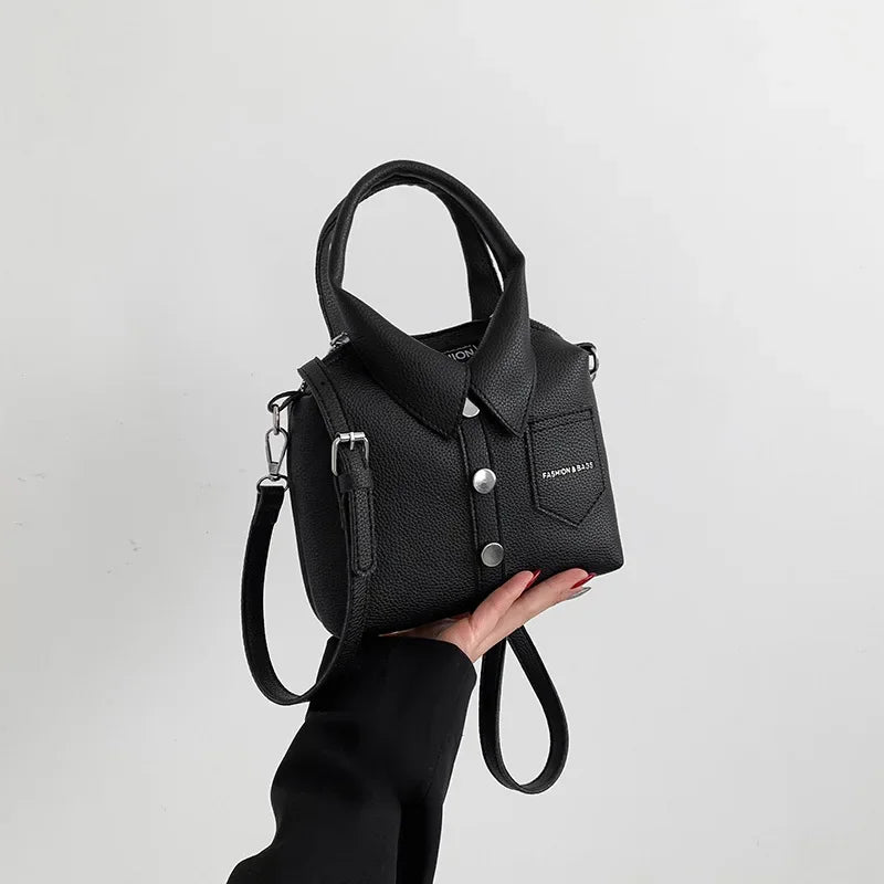 Square PU leather crossbody bag in black with front flap pocket and snap button details