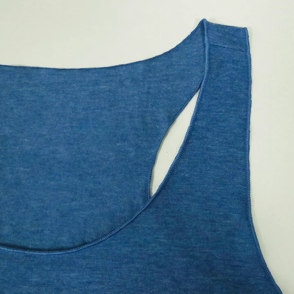 Women’s racerback tank top in blue, close-up of scoop neck and side cutout