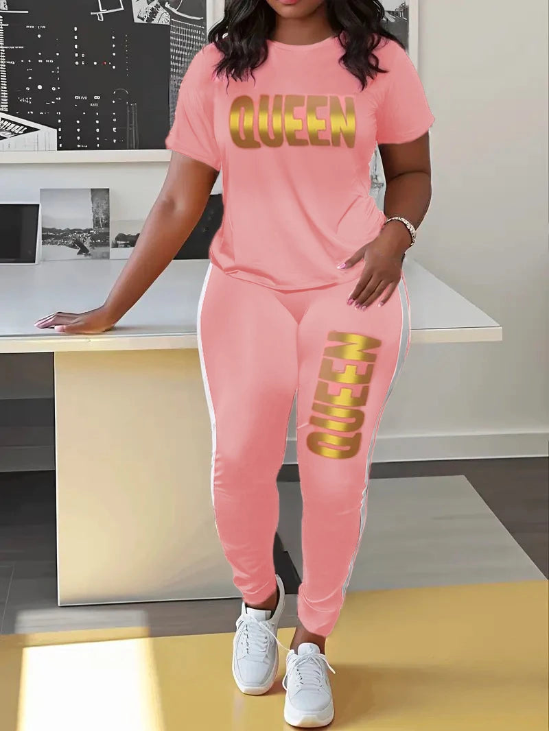 Pink T-shirt and jogger set with yellow QUEEN print on chest and jogger leg.
