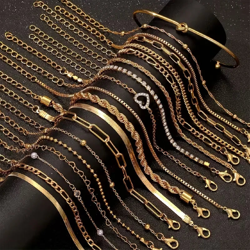 Gold-tone mixed chain bracelet set with pearl-like bead accents and toggle clasps