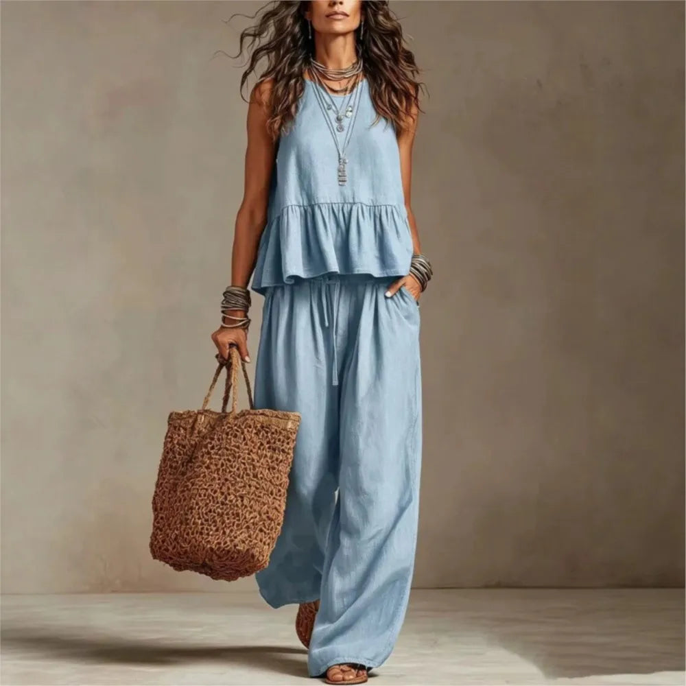 Light blue sleeveless ruffled top and wide-leg trouser set with tiered peplum