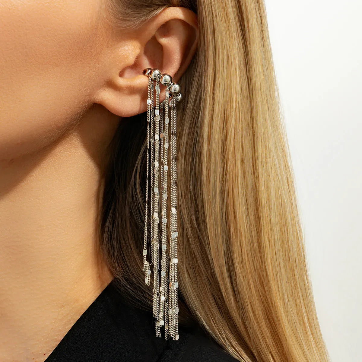 Silver C-shaped no-pierce ear clip with long chain tassels and bead drops