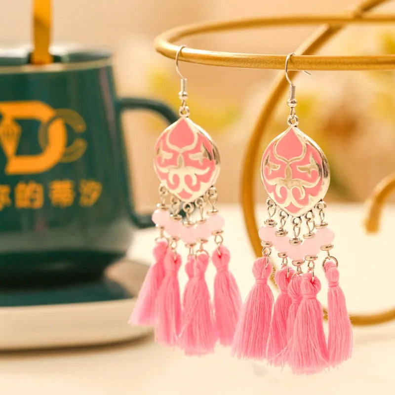 Boho tassel drop earrings with pink teardrop motif, bright pink tassels and beads