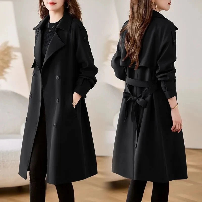 Women’s black belted trench coat with wide lapels and double-breasted button front