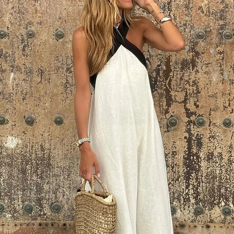 White sleeveless halter neck linen maxi dress with crisscross neckline and A-line flow