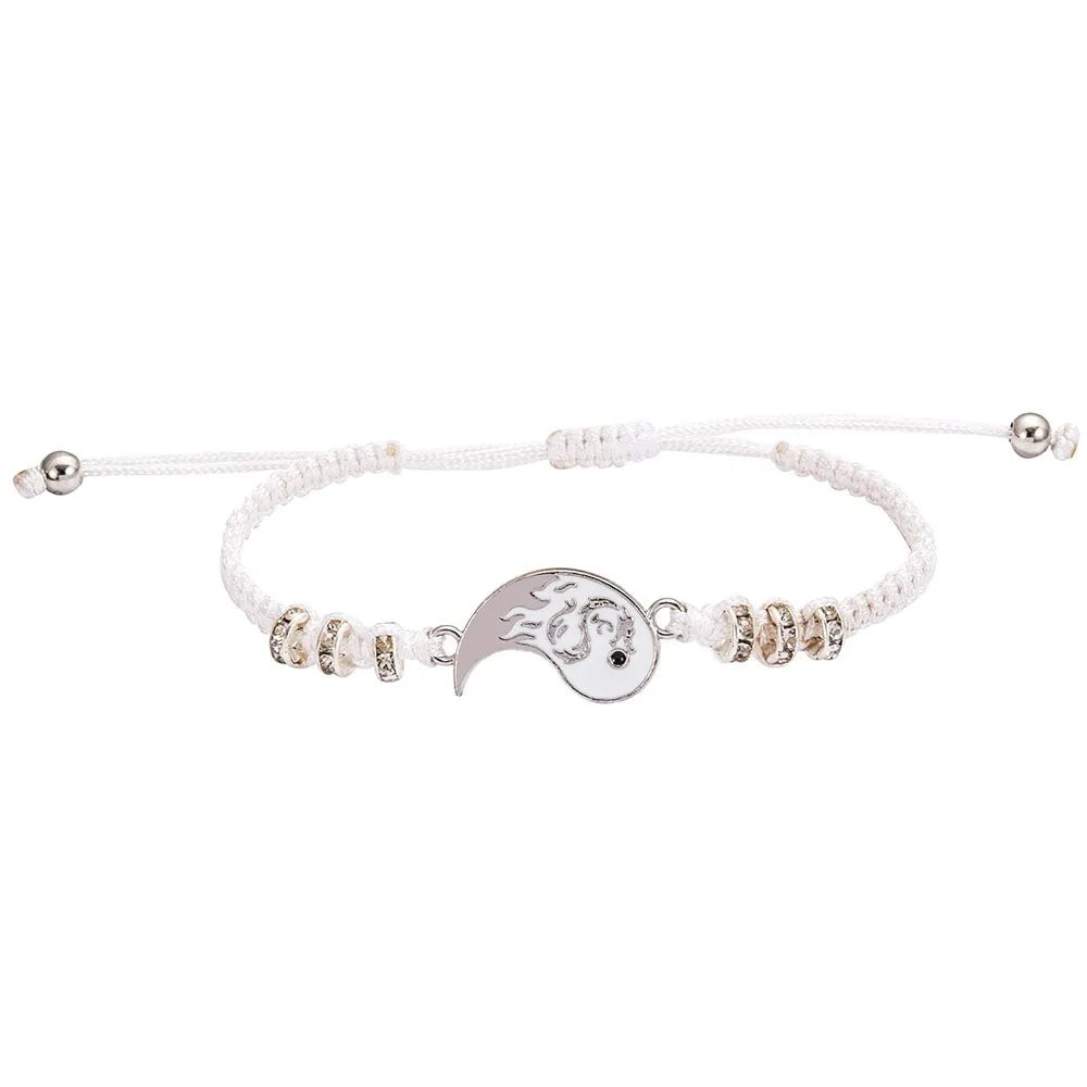 White cord bracelet with silver beaded segments and yin-yang dragon crescent pendant