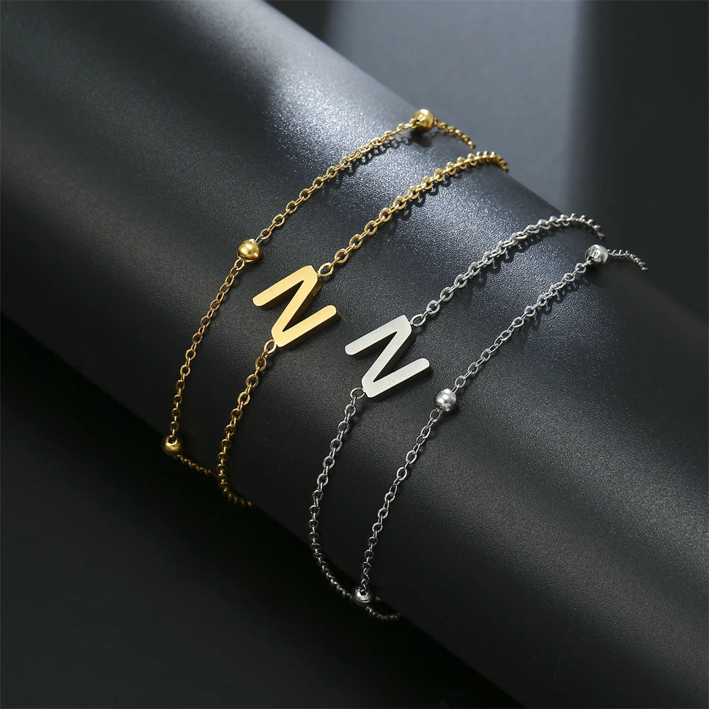 Initial letter bracelet set with Z and Z charms; gold and silver-tone chains