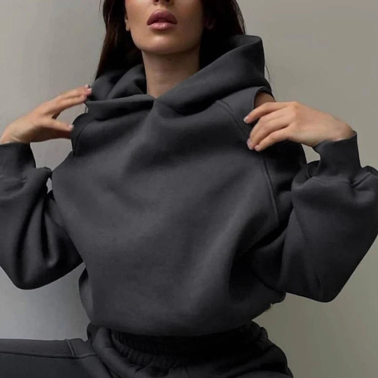 Dark gray hooded crop hoodie with matching jogger pants, loose fit and drawstring hood