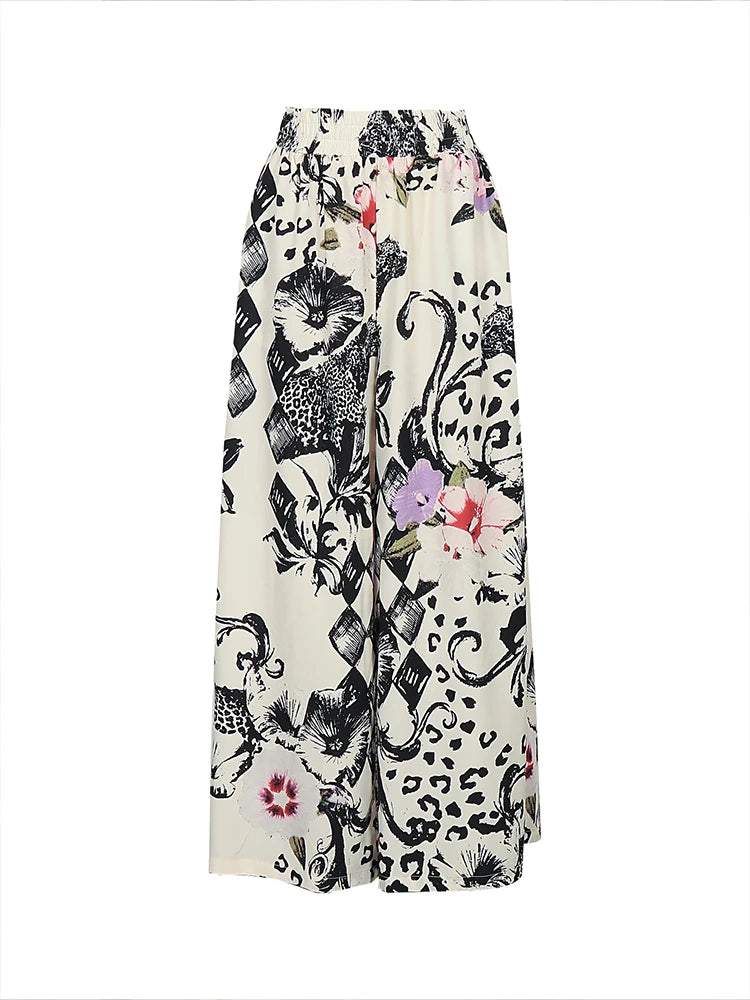 Women’s plus size wide-leg pants, cream with black animal-and-face collage print, colorful pops