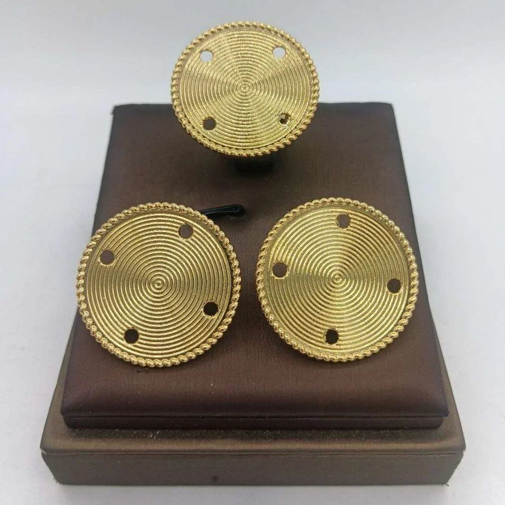 Gold-tone round stud earrings with concentric swirl pattern and dot accents