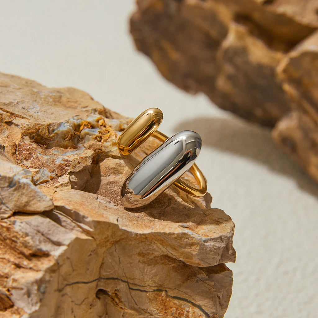 Geometric oval open ring in gold and silver tones, oval open-front design