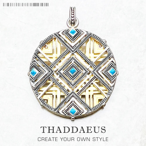 Round sterling silver pendant with blue gemstone accents and ornate diamond border