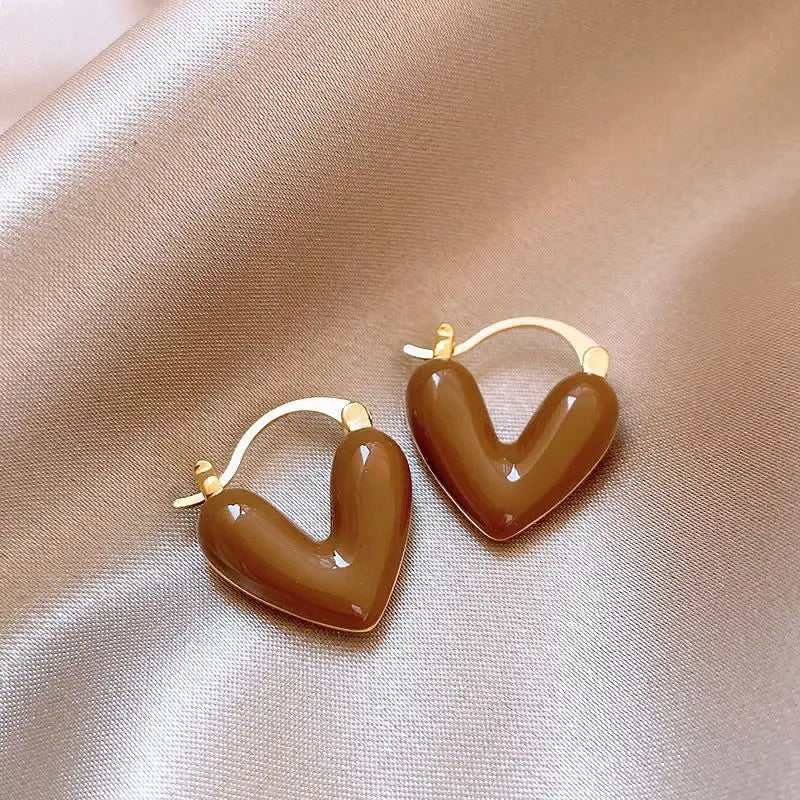 Glossy brown enamel U-shaped hoop earrings with gold posts and small bead accents