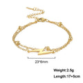 Gold chain charm bracelet with layered links and lightning bolt center charm