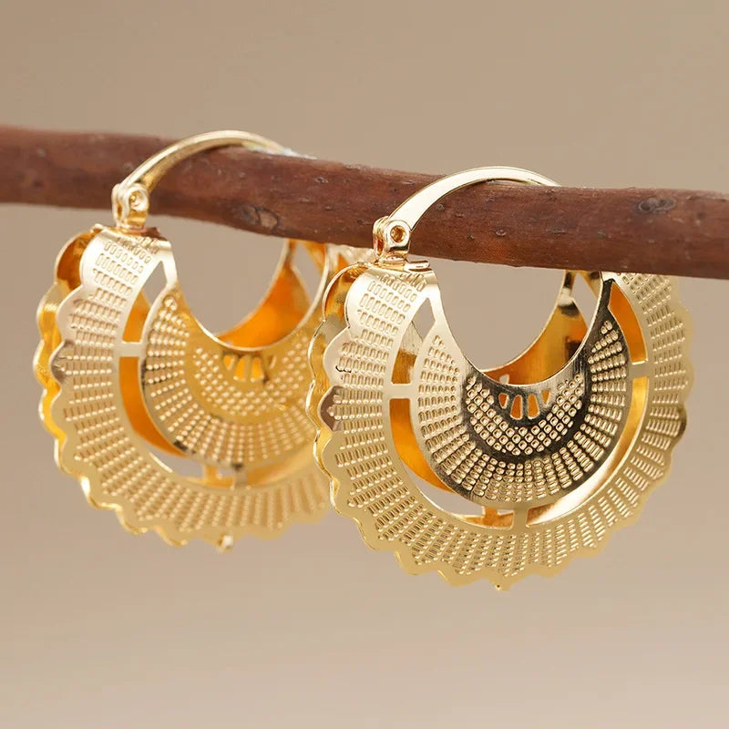 Gold hollow fan hoop earrings with concentric bead texture and scalloped border