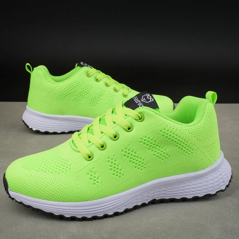 Neon green women's mesh platform sneakers, front view with lace-up closure
