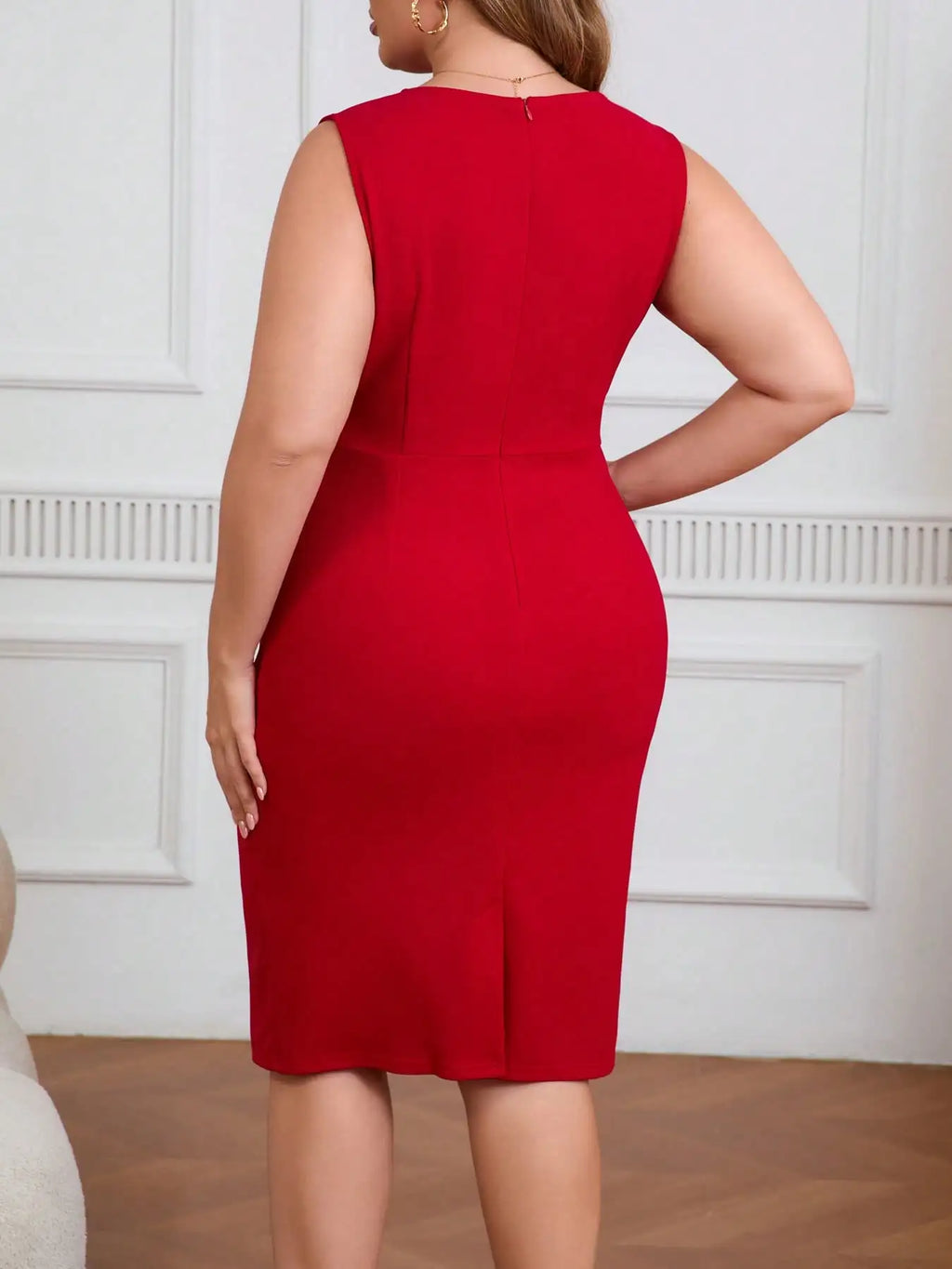 Red sleeveless bodycon sheath dress with crew neck; rear view